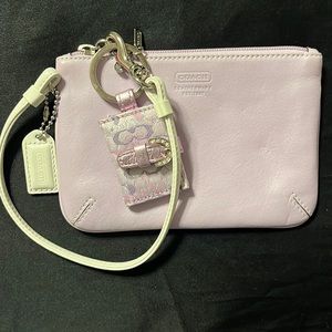 Coach lavender wristlet with photo keychain attached. Never used.